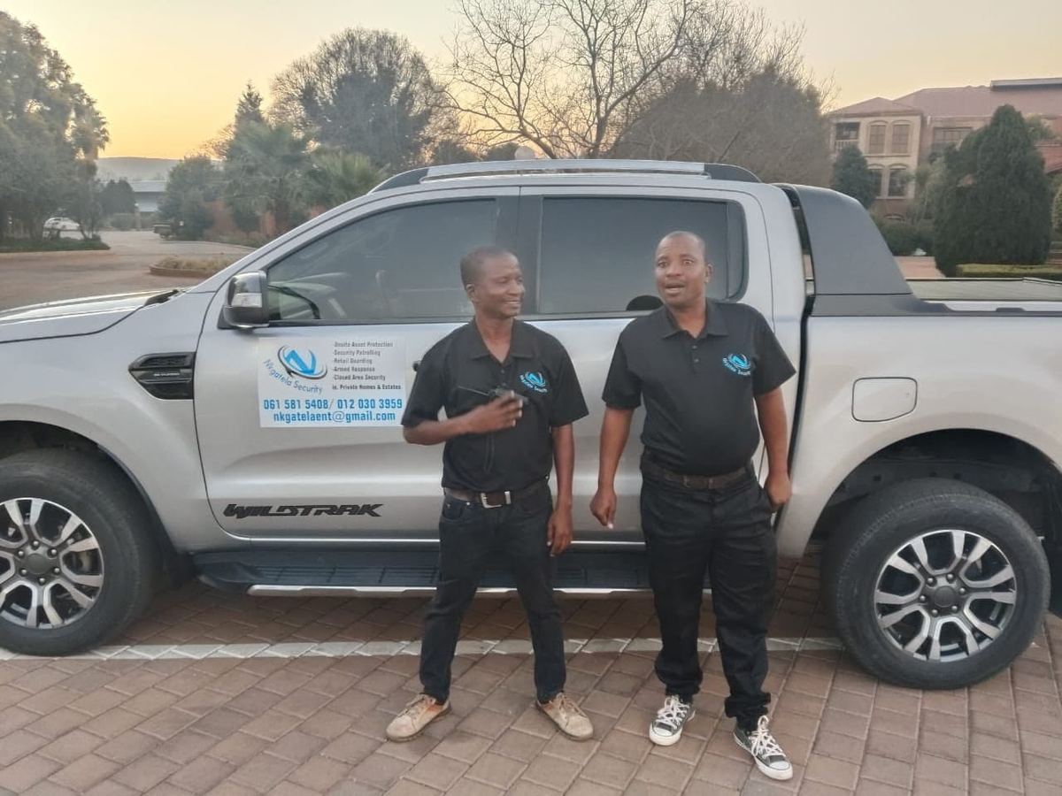 Nkgatela Security team with branded vehicle